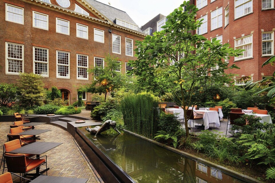 De heerlijke binnentuin van Sofitel Legend The Grand. Tuin The Grand
